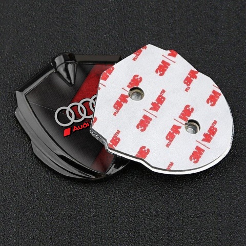 Audi Bodyside Emblem Badge Graphite Red Stone Surface Sport Rings