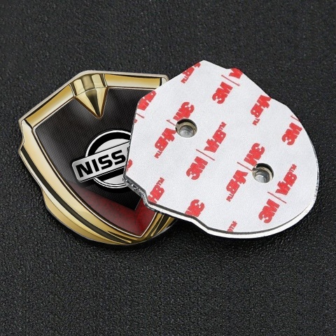 Nissan Domed Emblem Gold Ribbed Base Red V Shaped Element