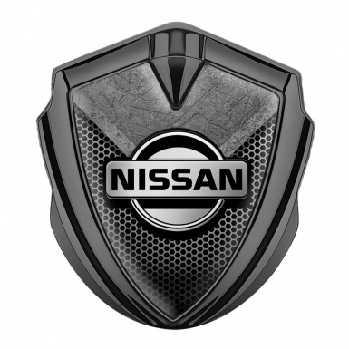 Nissan Bodyside Domed Emblem Graphite Hexagon Texture Stone Fragment