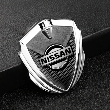 Nissan Bodyside Domed Emblem Silver Hexagon Texture Stone Fragment