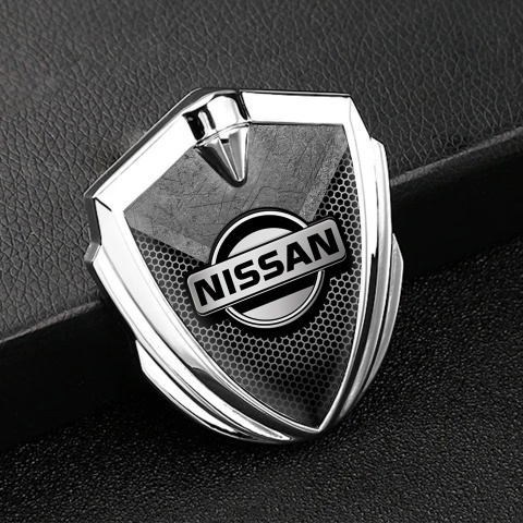 Nissan Bodyside Domed Emblem Silver Hexagon Texture Stone Fragment