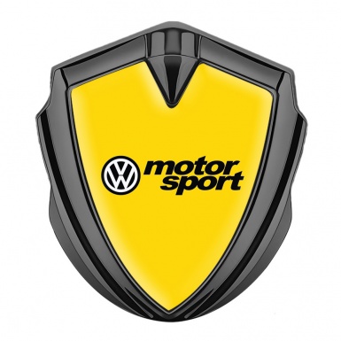 VW Domed Emblem Graphite Yellow Background Motorsport Logo Design